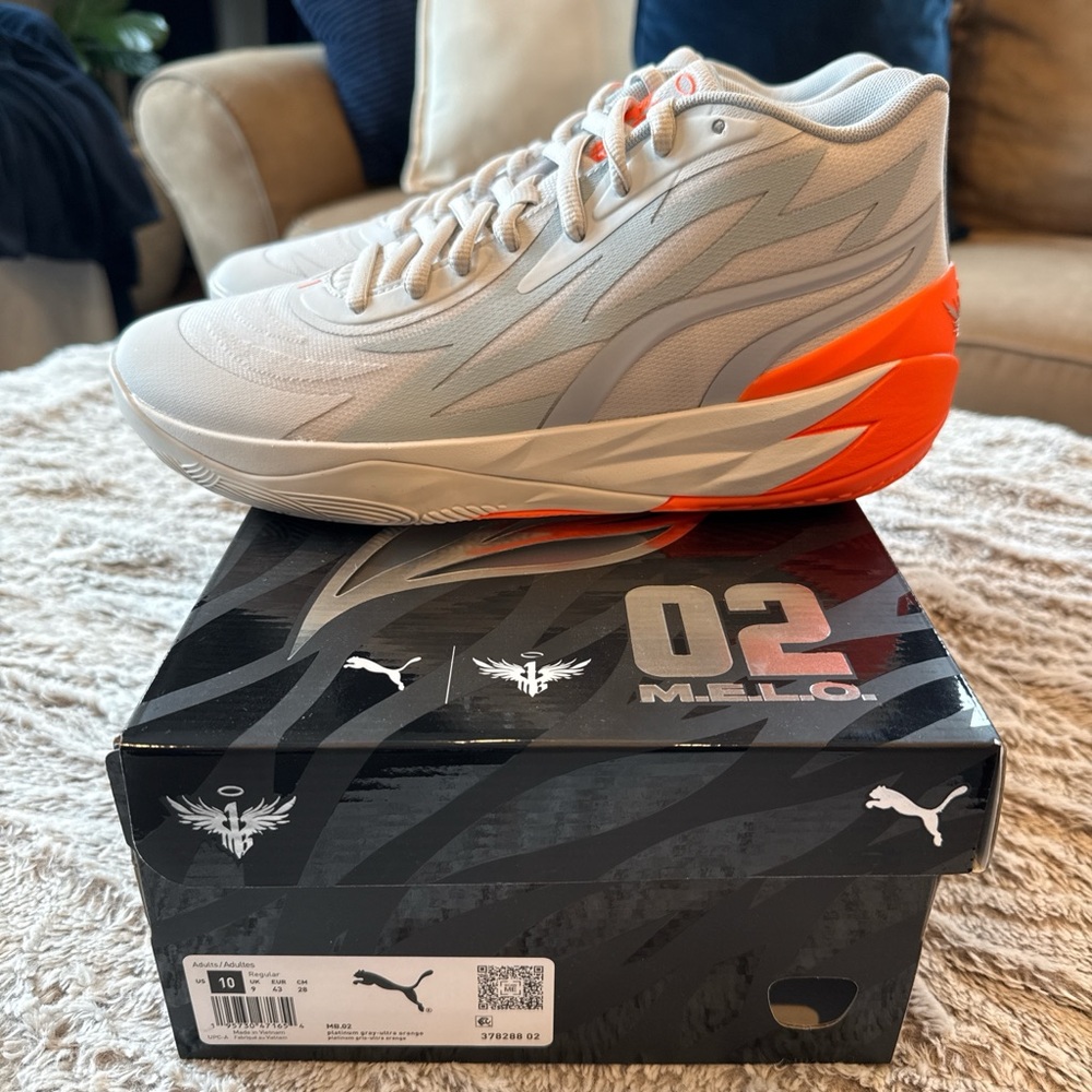 Puma Melo Basketball Shoes in Light Gray and Vibrant Orange